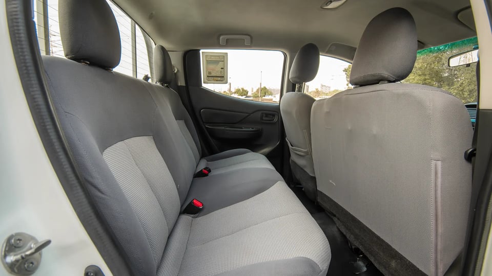 Used 2021 Mitsubishi L200 GL Double Cabin in White – Rear Passenger Side Cabin View for Sale at First Choice Cars Dubai Sharjah