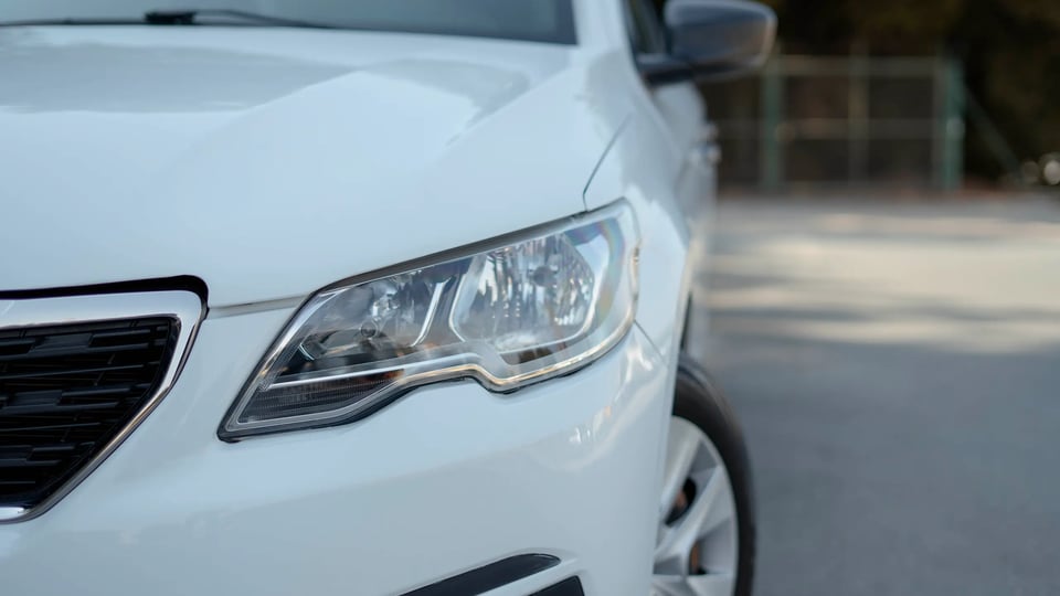 Used 2021 Peugeot 301 Allure in White – Headlight Close-up for Sale at First Choice Cars Dubai Sharjah