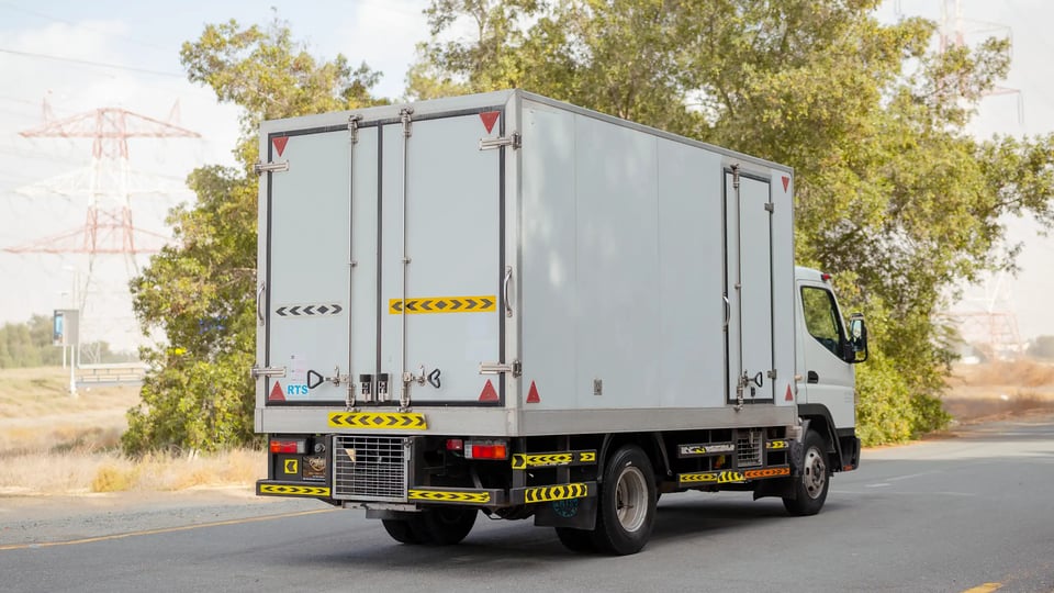 Used 2020 Mitsubishi Canter Chiller Box in White – Right Back Diagonal (45°) View for Sale at First Choice Cars Dubai Sharjah