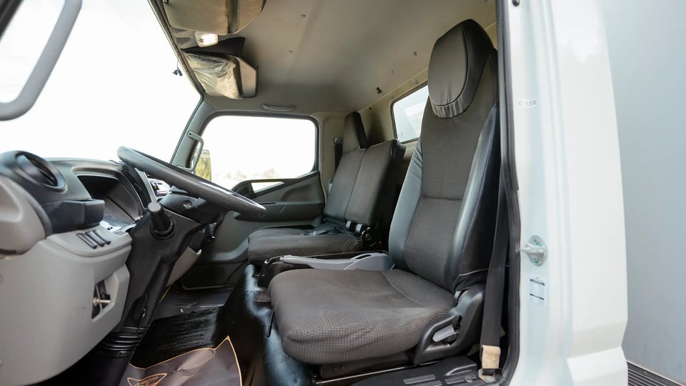 Used 2020 Mitsubishi Canter Chiller Box in White – Front Driver Side Cabin View for Sale at First Choice Cars Dubai Sharjah