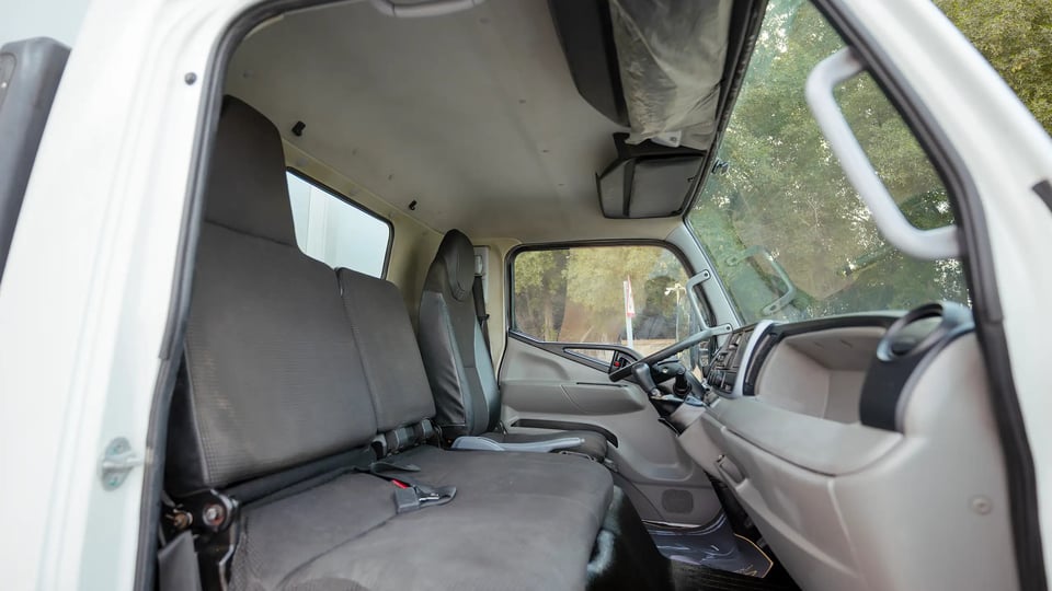 Used 2020 Mitsubishi Canter Chiller Box in White – Front Passenger Side Cabin View for Sale at First Choice Cars Dubai Sharjah