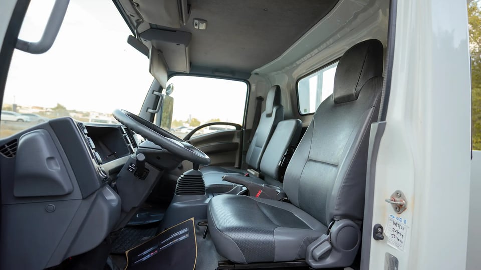 Used 2017 Isuzu NPR Recovery in White – Front Driver Side Cabin View for Sale at First Choice Cars Dubai Sharjah