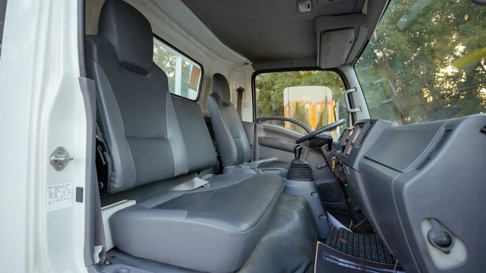 Used 2017 Isuzu NPR Recovery in White – Front Passenger Side Cabin View for Sale at First Choice Cars Dubai Sharjah