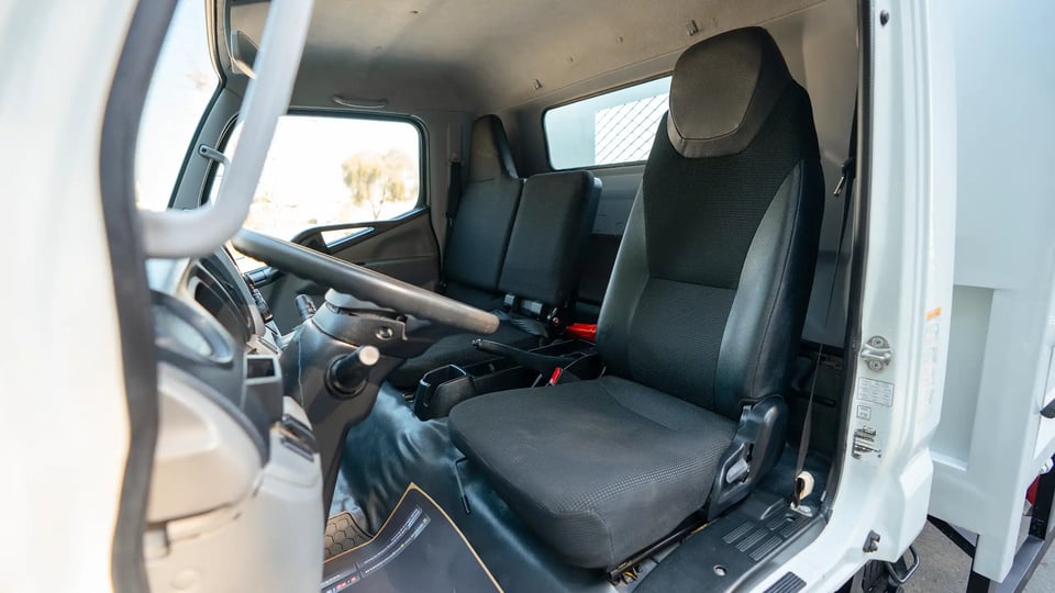 Used 2022 Mitsubishi Canter Cargo Body in White – Front Driver Side Cabin View for Sale at First Choice Cars Dubai Sharjah