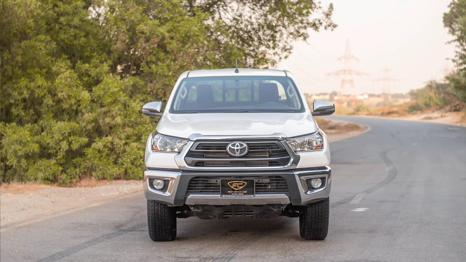 Used 2024 Toyota Hilux GLX Double Cabin in White – Front View for Sale at First Choice Cars Dubai Sharjah