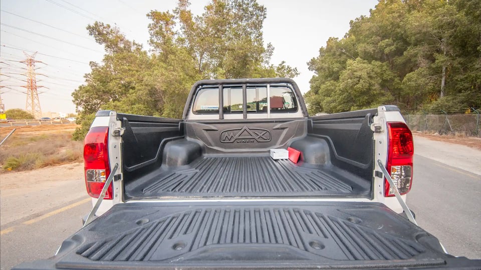 Used 2024 Toyota Hilux GLX Double Cabin in White – Boot / Trunk Space Open View for Sale at First Choice Cars Dubai Sharjah