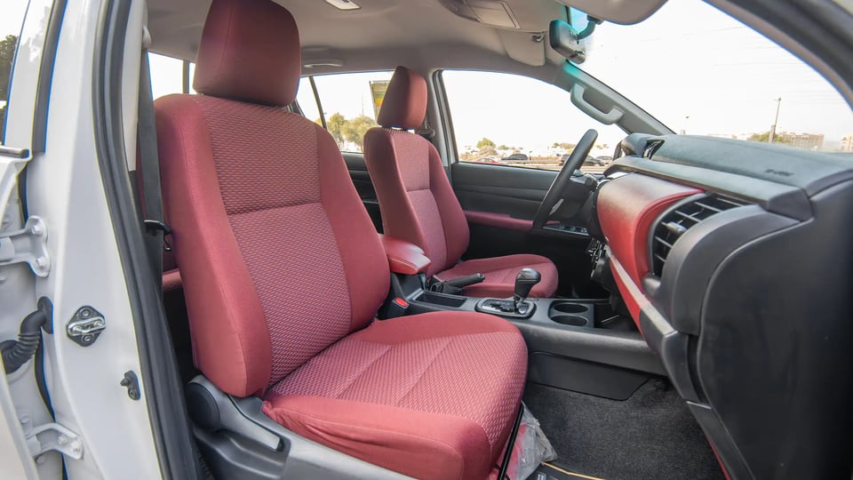 Used 2024 Toyota Hilux GLX Double Cabin in White – Front Passenger Side Cabin View for Sale at First Choice Cars Dubai Sharjah