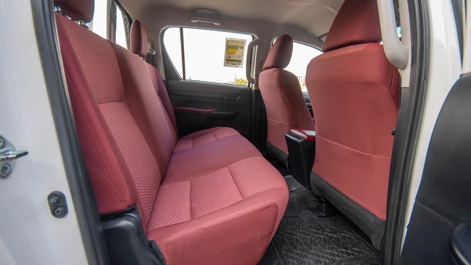 Used 2024 Toyota Hilux GLX Double Cabin in White – Rear Passenger Side Cabin View for Sale at First Choice Cars Dubai Sharjah