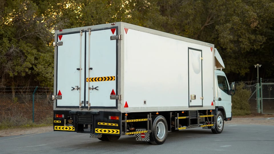 Used 2017 Mitsubishi Canter Chiller Box in White – Right Back Diagonal (45°) View for Sale at First Choice Cars Dubai Sharjah