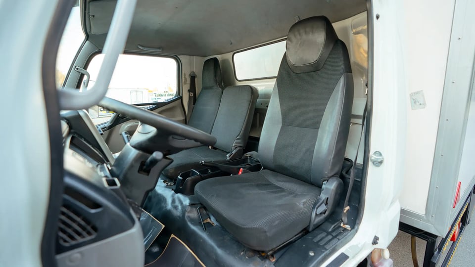 Used 2017 Mitsubishi Canter Chiller Box in White – Front Driver Side Cabin View for Sale at First Choice Cars Dubai Sharjah