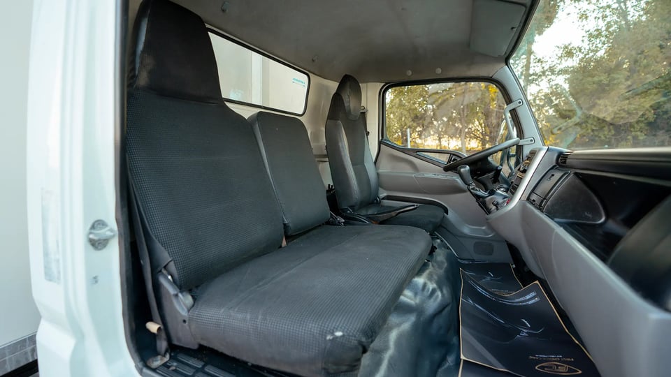 Used 2017 Mitsubishi Canter Chiller Box in White – Front Passenger Side Cabin View for Sale at First Choice Cars Dubai Sharjah