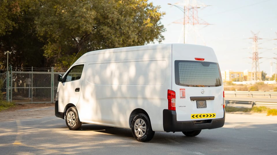 Used 2022 Nissan Urvan High Roof in White – Left Back Diagonal (45°) View for Sale at First Choice Cars Dubai Sharjah