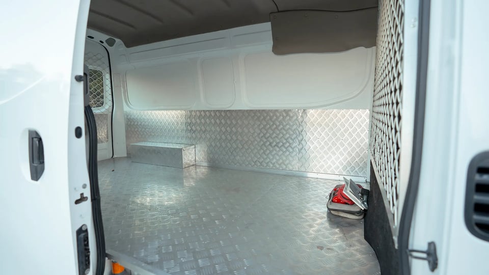 Used 2022 Nissan Urvan High Roof in White – Delivery Box Right Side Interior View for Sale at First Choice Cars Dubai Sharjah