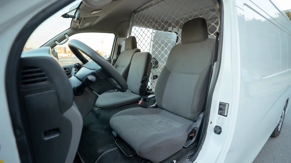 Used 2022 Nissan Urvan High Roof in White – Front Driver Side Cabin View for Sale at First Choice Cars Dubai Sharjah