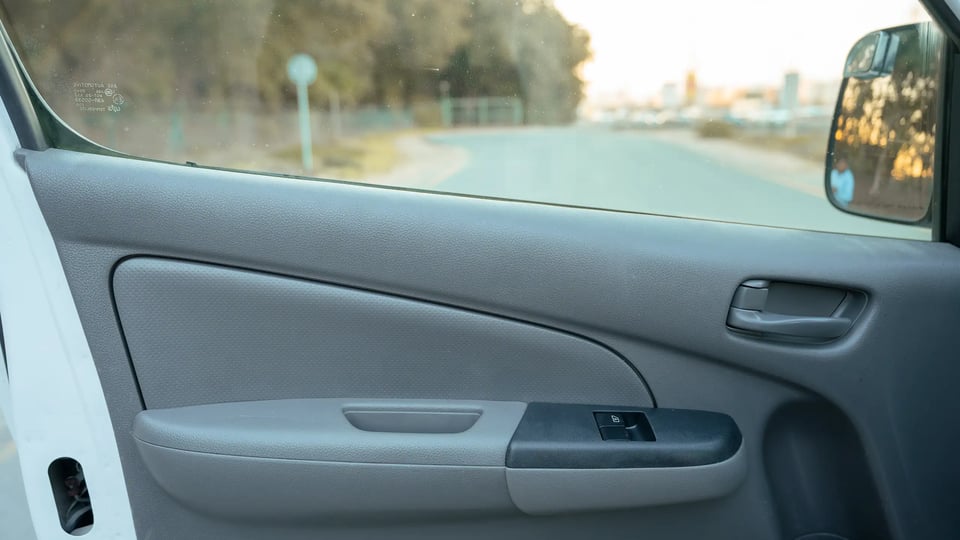 Used 2022 Nissan Urvan High Roof in White – Driver Door Panel Full View for Sale at First Choice Cars Dubai Sharjah