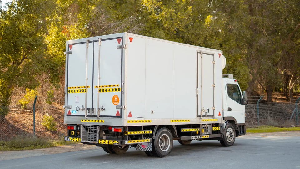 Used 2020 Mitsubishi Canter Chiller Box in White – Right Back Diagonal (45°) View for Sale at First Choice Cars Dubai Sharjah