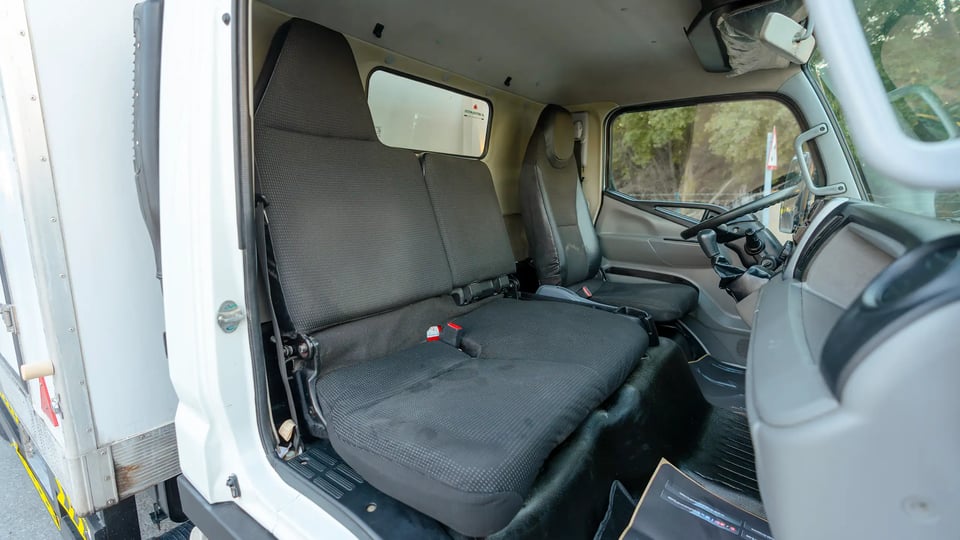 Used 2020 Mitsubishi Canter Chiller Box in White – Front Passenger Side Cabin View for Sale at First Choice Cars Dubai Sharjah