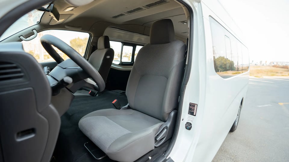 Used 2024 Nissan Urvan High Roof White – Front Driver Side Cabin View at First Choice Cars Sharjah