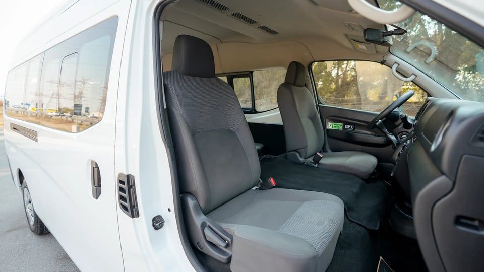 Used 2024 Nissan Urvan High Roof White – Front Passenger Side Cabin View at First Choice Cars Sharjah