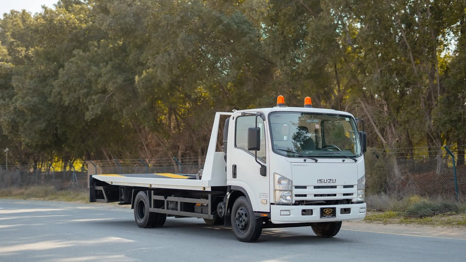 Used 2017 Isuzu NPR Recovery in White – Right Front Diagonal (45°) View for Sale at First Choice Cars Dubai Sharjah