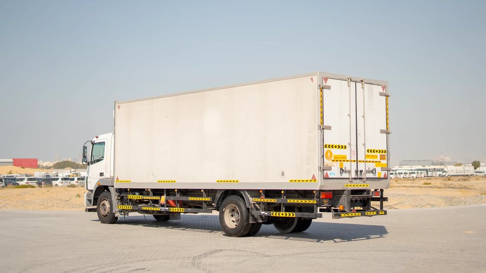 Used 2020 Mitsubishi Fuso FJ Freezer Box in White – Left Back Diagonal (45°) View for Sale at First Choice Cars Dubai Sharjah