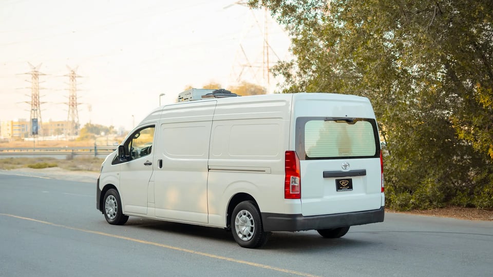 Used 2020 Toyota Hiace GL High Roof in White – Left Back Diagonal (45°) View for Sale at First Choice Cars Dubai Sharjah