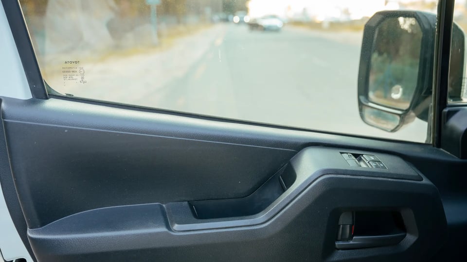 Used 2020 Toyota Hiace GL High Roof in White – Driver Door Panel Full View for Sale at First Choice Cars Dubai Sharjah