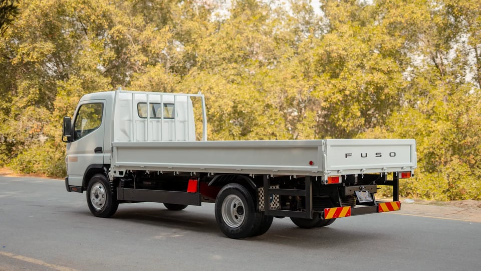 Used 2017 Mitsubishi Canter Cargo Body in White – Left Back Diagonal (45°) View for Sale at First Choice Cars Dubai Sharjah