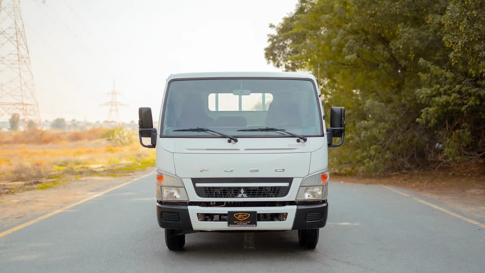 Used 2017 Mitsubishi Canter Cargo Body in White – Front View for Sale at First Choice Cars Dubai Sharjah