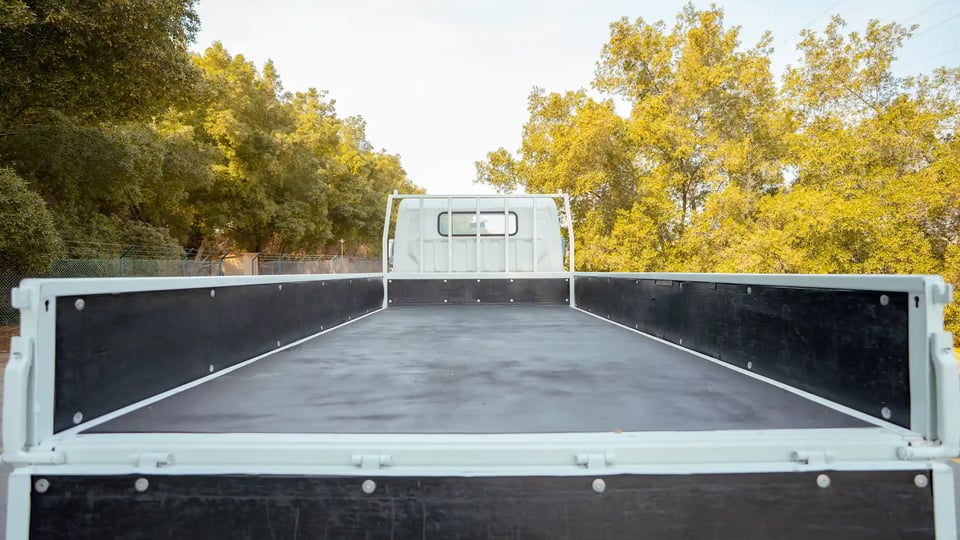 Used 2017 Mitsubishi Canter Cargo Body in White – Cargo Bed Rear-to-Front View for Sale at First Choice Cars Dubai Sharjah