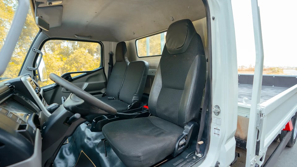 Used 2017 Mitsubishi Canter Cargo Body in White – Front Driver Side Cabin View for Sale at First Choice Cars Dubai Sharjah