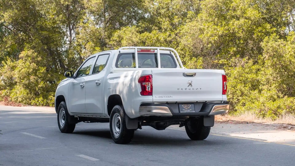 Used 2023 Peugeot Landtrek Double Cabin in White – Left Back Diagonal (45°) View for Sale at First Choice Cars Dubai Sharjah