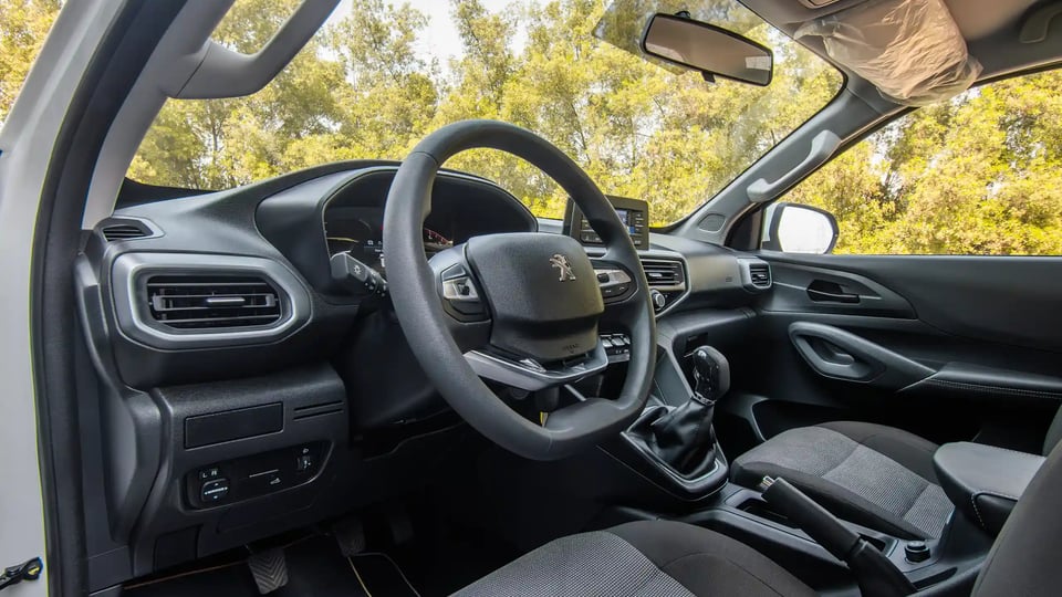 Used 2023 Peugeot Landtrek Double Cabin in White – Driver Side Dashboard & Steering View for Sale at First Choice Cars Dubai Sharjah