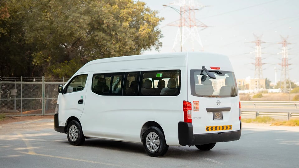 Used 2024 Nissan Urvan High Roof in White – Left Back Diagonal (45°) View for Sale at First Choice Cars Dubai Sharjah