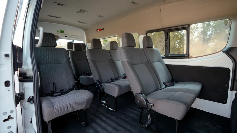 Used 2024 Nissan Urvan High Roof in White – Rear Passenger Side Cabin View for Sale at First Choice Cars Dubai Sharjah