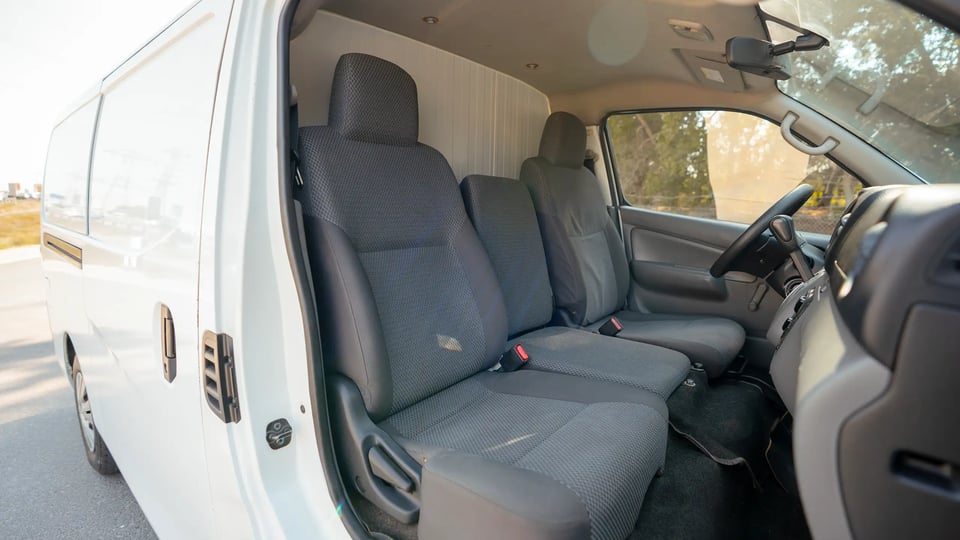 Used 2020 Nissan Urvan Standard Roof in White – Front Passenger Side Cabin View for Sale at First Choice Cars Dubai Sharjah