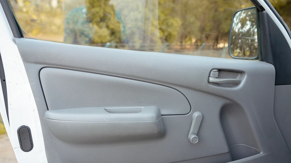 Used 2020 Nissan Urvan Standard Roof in White – Driver Door Panel Full View for Sale at First Choice Cars Dubai Sharjah