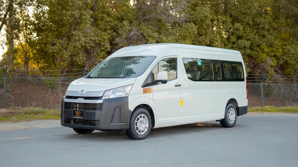 Used 2021 Toyota Hiace GL High Roof in White – Left Front Diagonal (45°) View for Sale at First Choice Cars Dubai Sharjah