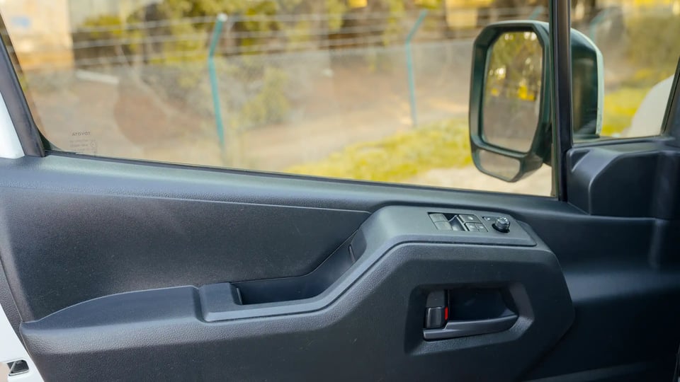 Used 2021 Toyota Hiace GL High Roof in White – Driver Door Panel Full View for Sale at First Choice Cars Dubai Sharjah