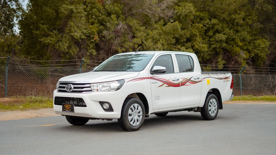 Used 2021 Toyota Hilux GLX Double Cabin in White – Left Front Diagonal (45°) View for Sale at First Choice Cars Dubai Sharjah