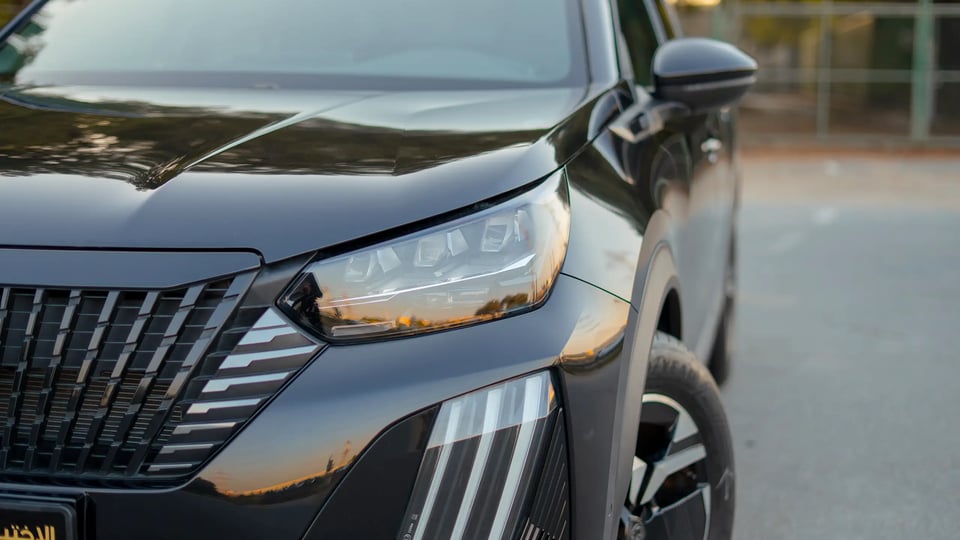 Used 2024 Peugeot 2008 GT in Black – Headlight Close-up for Sale at First Choice Cars Dubai Sharjah