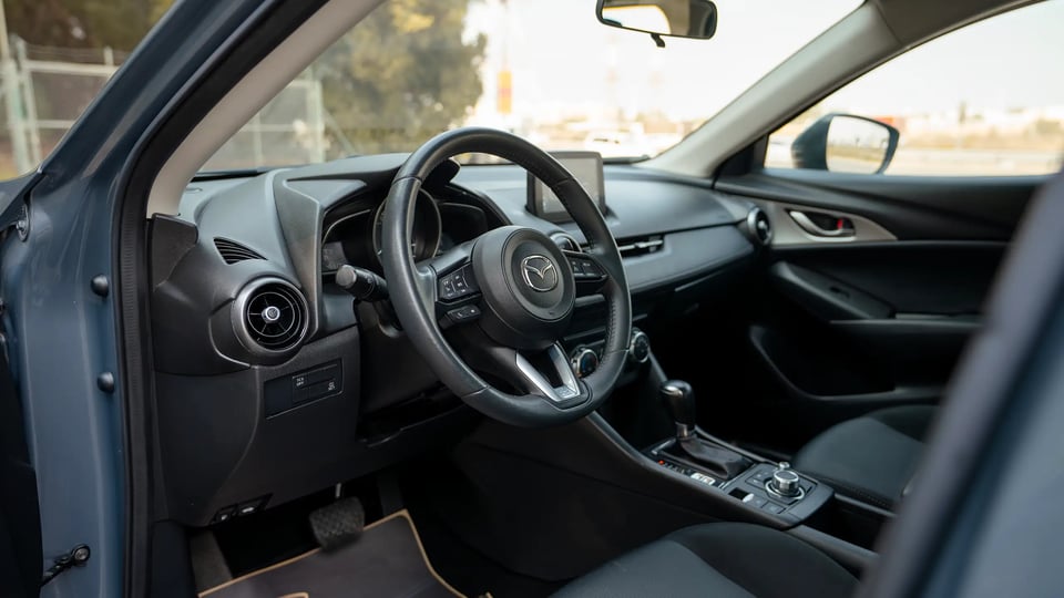Used 2023 Mazda CX-3 GS in Blue – Driver Side Dashboard & Steering View for Sale at First Choice Cars Dubai Sharjah