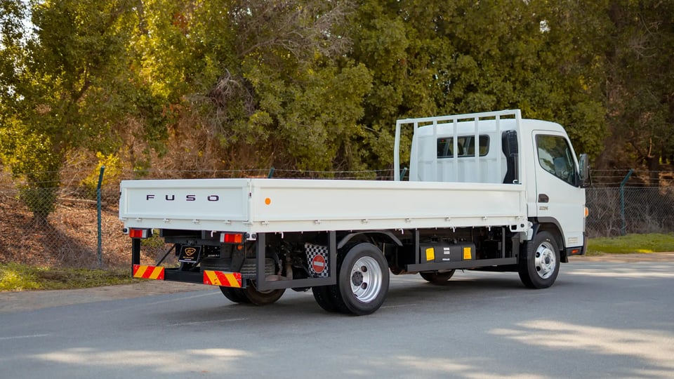 Used 2023 Mitsubishi Canter Cargo Body in White – Right Back Diagonal (45°) View for Sale at First Choice Cars Dubai Sharjah