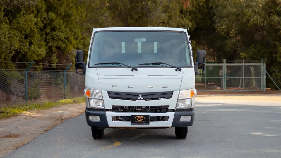 Used 2023 Mitsubishi Canter Cargo Body in White – Front View for Sale at First Choice Cars Dubai Sharjah