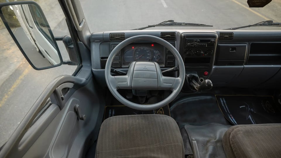 Used 2006 Mitsubishi Canter Double Cabin Cargo Body in White – Steering Wheel & Instrument Cluster for Sale at First Choice Cars Dubai Sharjah