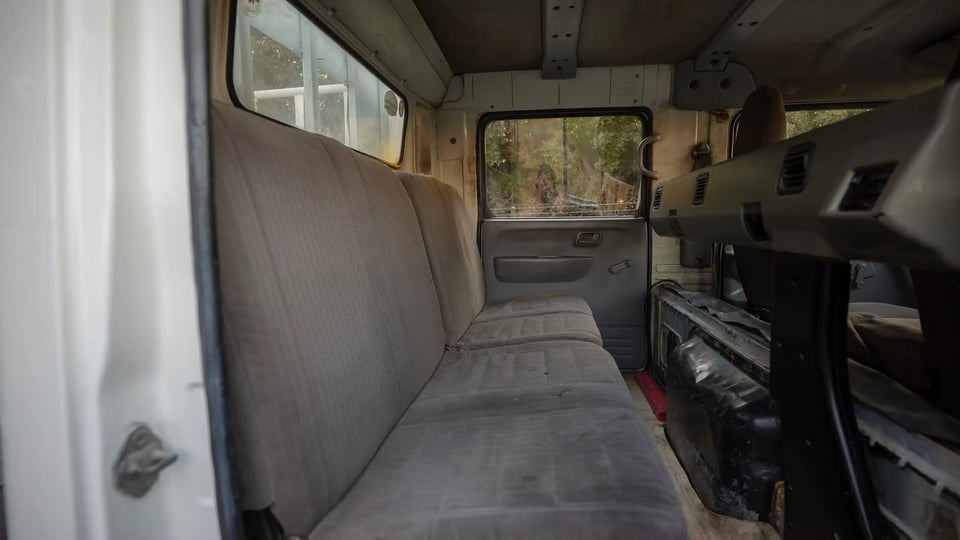 Used 2006 Mitsubishi Canter Double Cabin Cargo Body in White – Rear Passenger Side Cabin View for Sale at First Choice Cars Dubai Sharjah