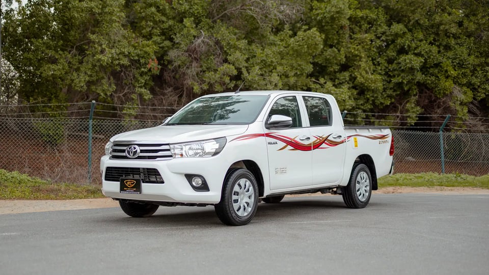 Used 2021 Toyota Hilux GLX Double Cabin in White – Left Front Diagonal (45°) View for Sale at First Choice Cars Dubai Sharjah