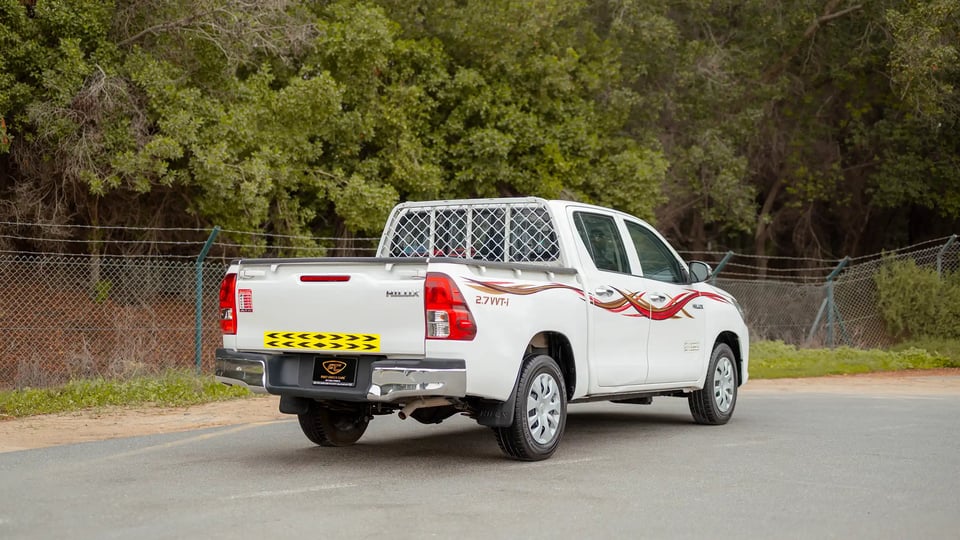 Used 2021 Toyota Hilux GLX Double Cabin in White – Right Back Diagonal (45°) View for Sale at First Choice Cars Dubai Sharjah