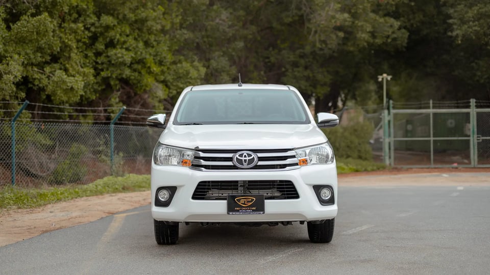 Used 2021 Toyota Hilux GLX Double Cabin in White – Front View for Sale at First Choice Cars Dubai Sharjah