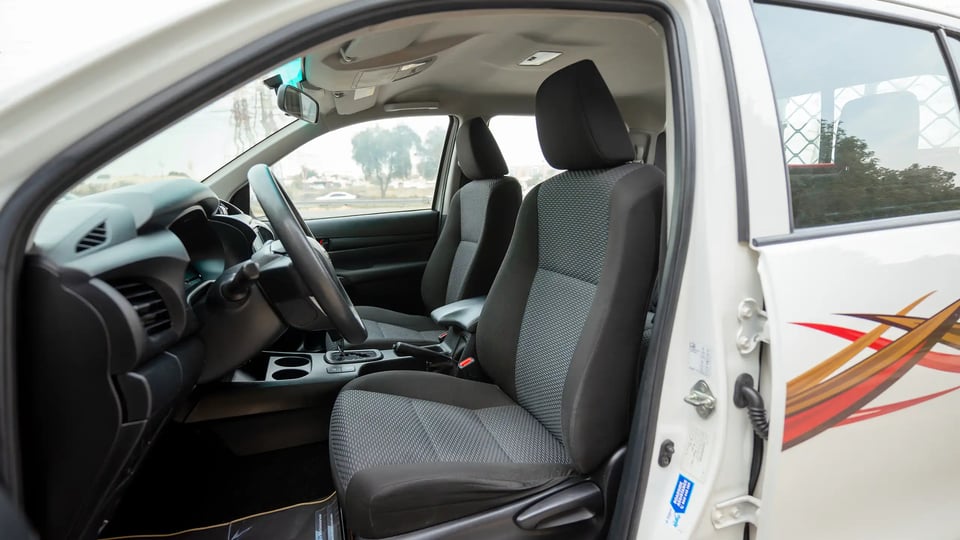Used 2021 Toyota Hilux GLX Double Cabin in White – Front Driver Side Cabin View for Sale at First Choice Cars Dubai Sharjah